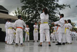 Yellow and orange belts doing basics in a circle